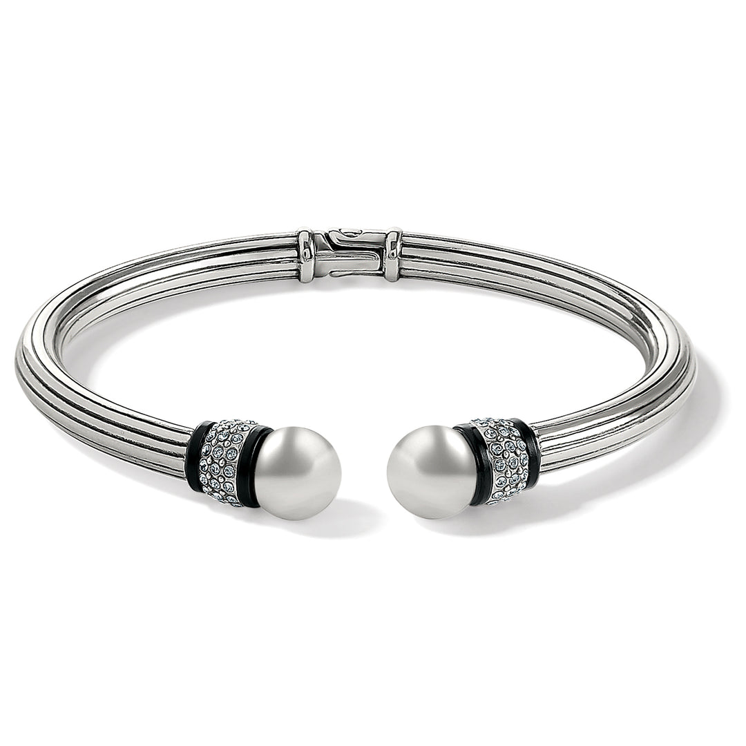 Silver-plated Meridian open hinged bangle with black accents and pearl-like end caps.