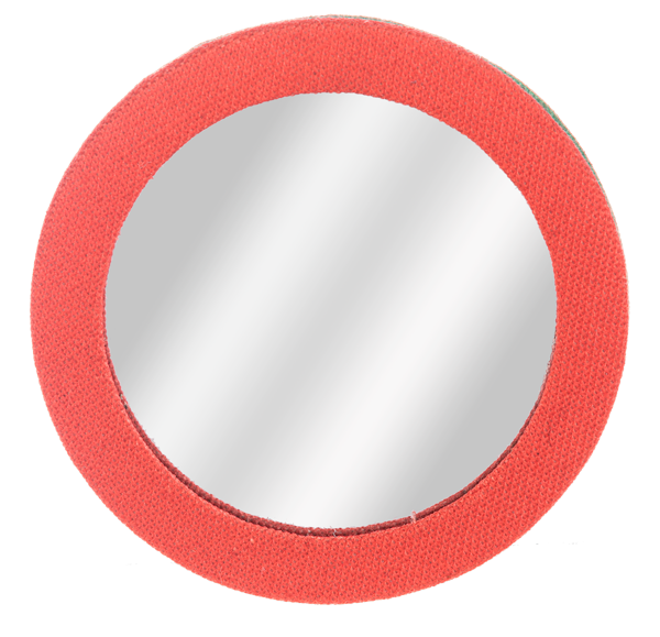 Round travel compact mirror with a textured red embroidered fabric border.