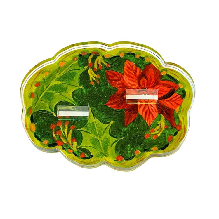 Large double stand featuring a poinsettia leaf pattern in red and green with gold accents.