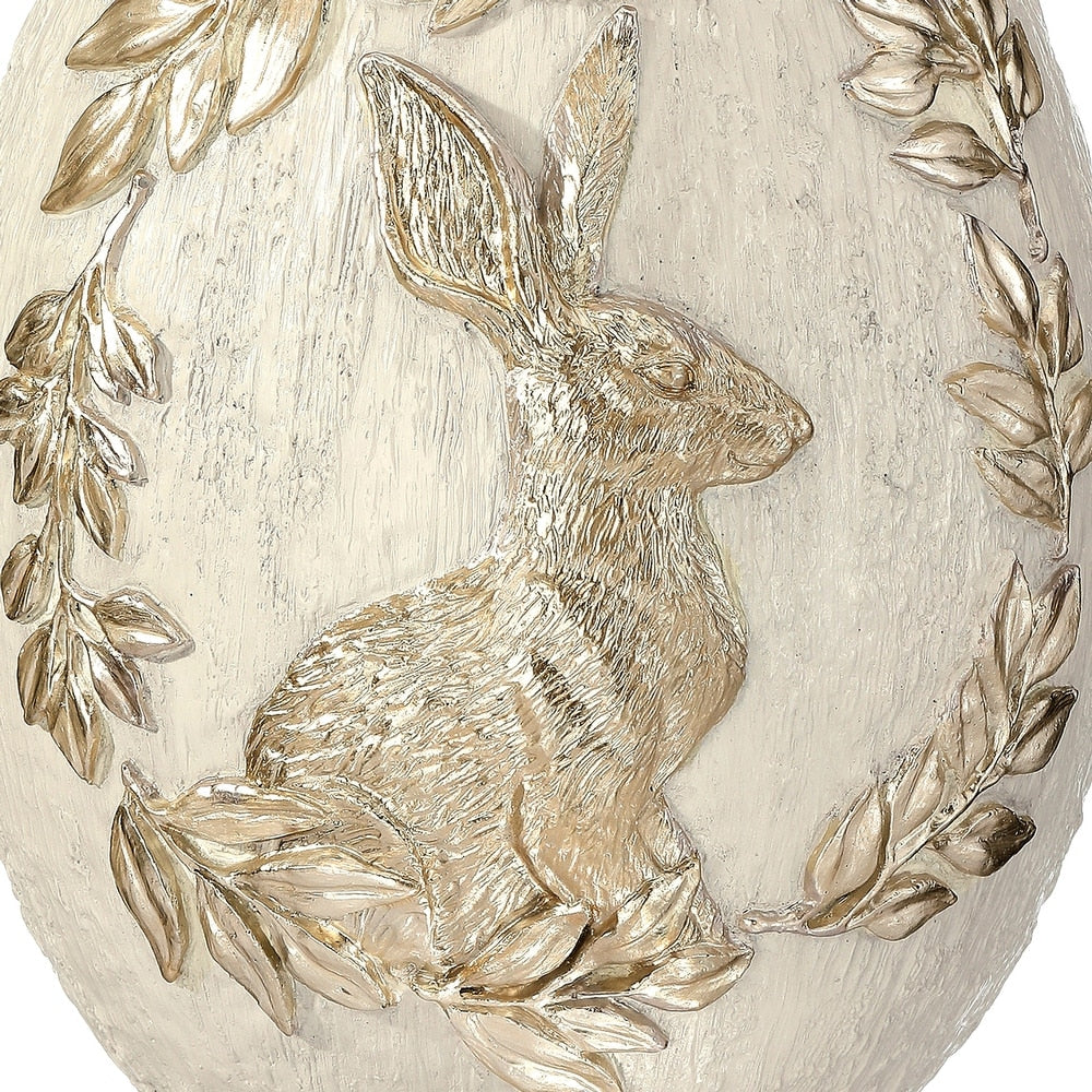 8.5-inch resin decorative egg in royal blue with a white bunny silhouette on top.
