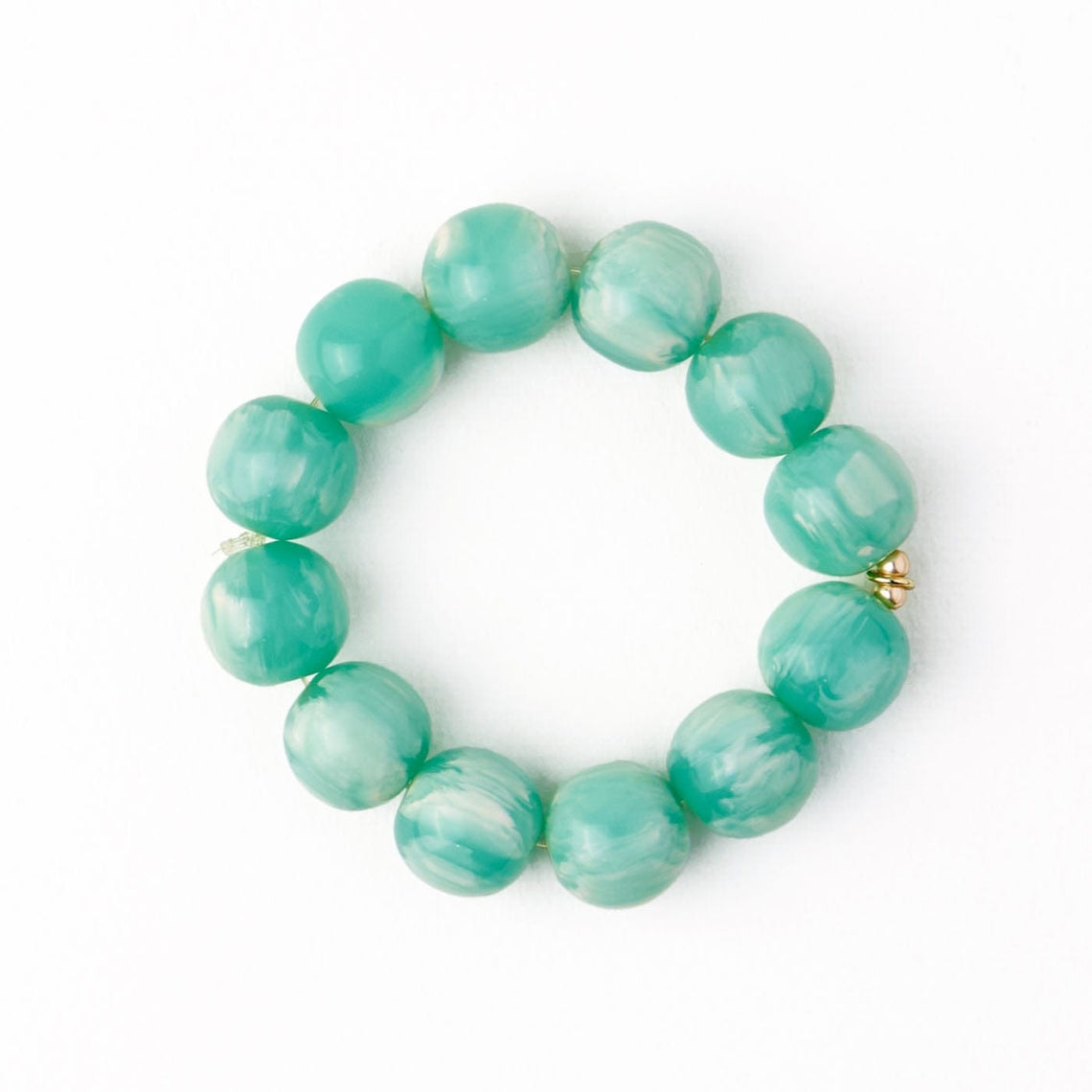 Cece Large Resin Bead Bracelet featuring oversized marbled teal and white beads in a circle.
