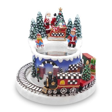 Musical Ice Skating Winter Scene with Santa, skaters, and a moving train on a snowy base.