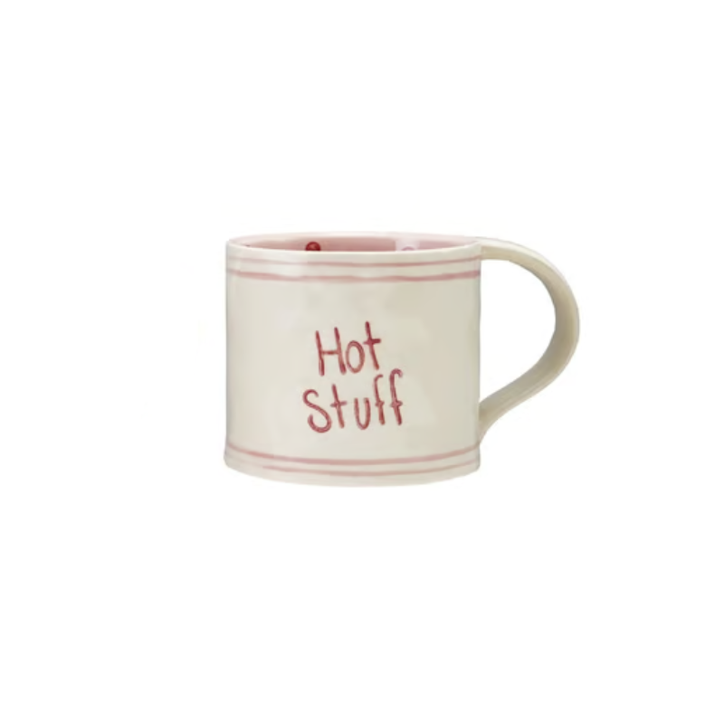 Hand-painted stoneware mug in cream with pink stripes and "Hot Stuff" written in red.