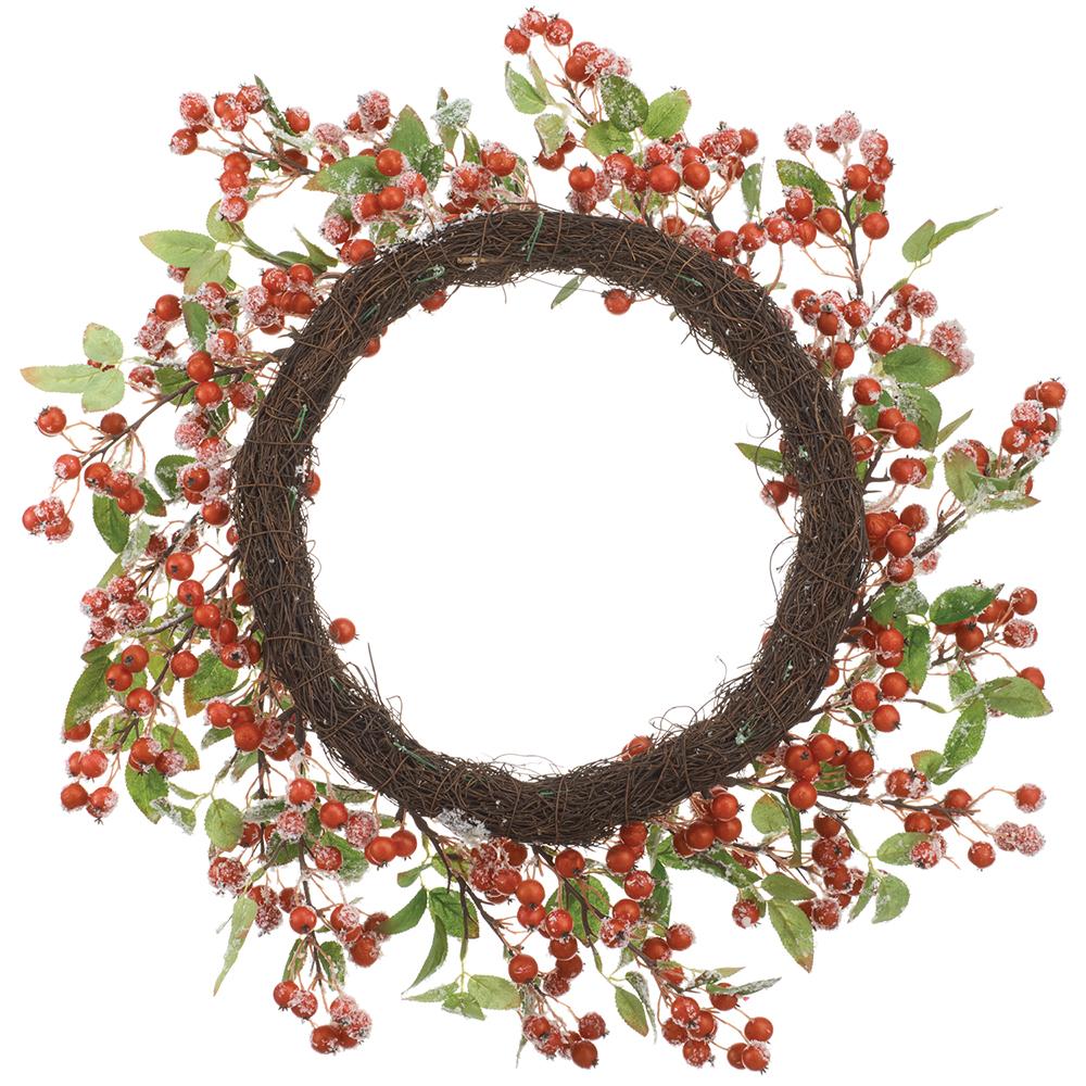 24-inch wreath with red berries, green leaves, and frosted snow accents on a brown grapevine base.