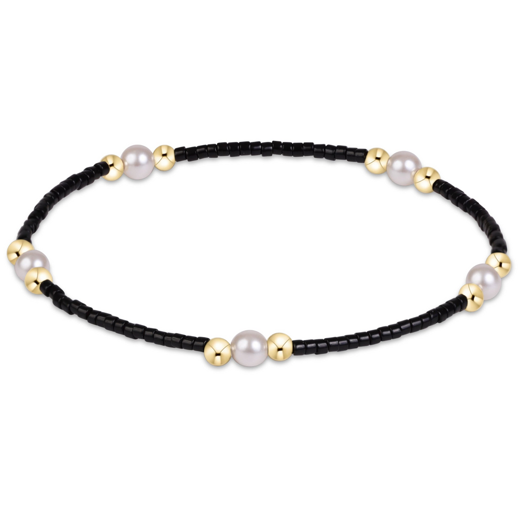 Gameday Hope Purpose Pearl Bracelet with black seed beads, gold-filled beads, and white pearls.