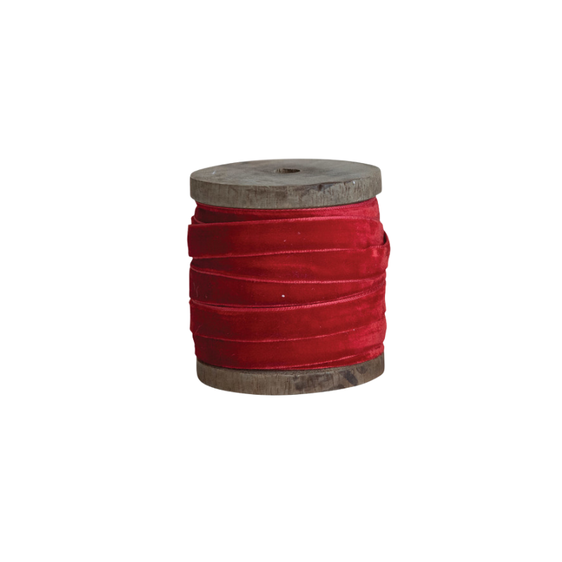 10 yards of red velvet ribbon wrapped around a rustic wooden spool.