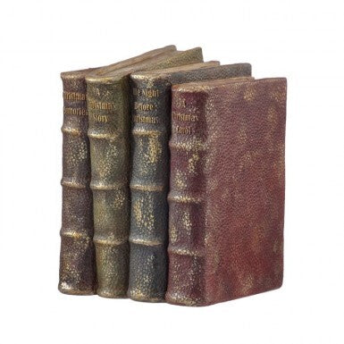 A stack of four antique-style resin books in shades of brown, green, blue, and red.