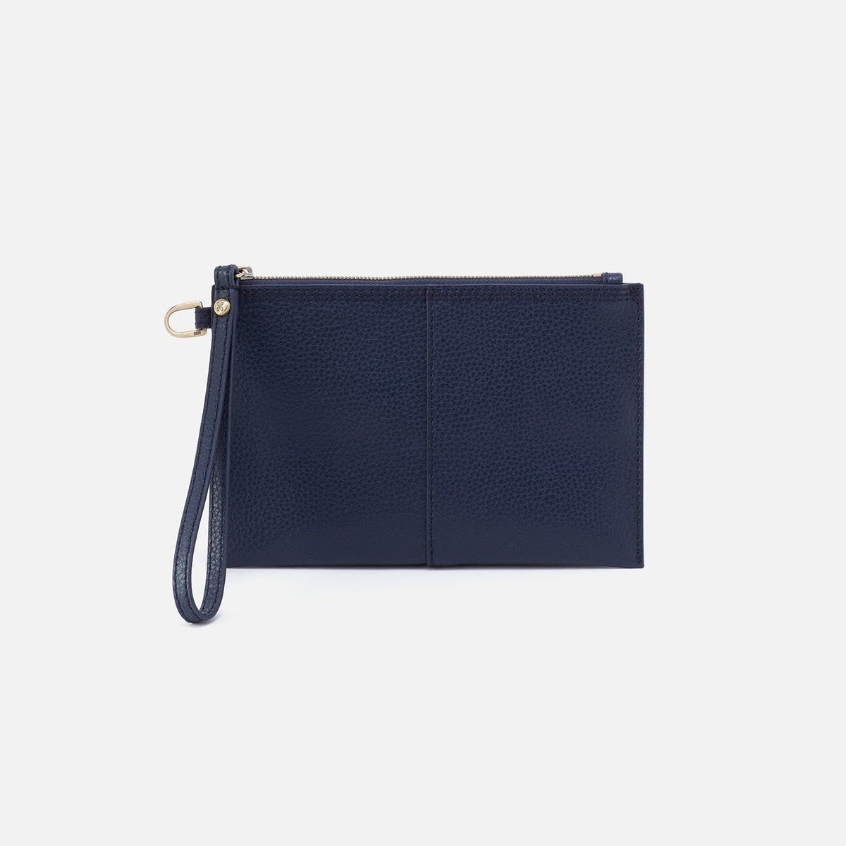 Indigo suede Vida small pouch with coconut shell interior, brass hardware, zip closure, and leather wristlet strap.
