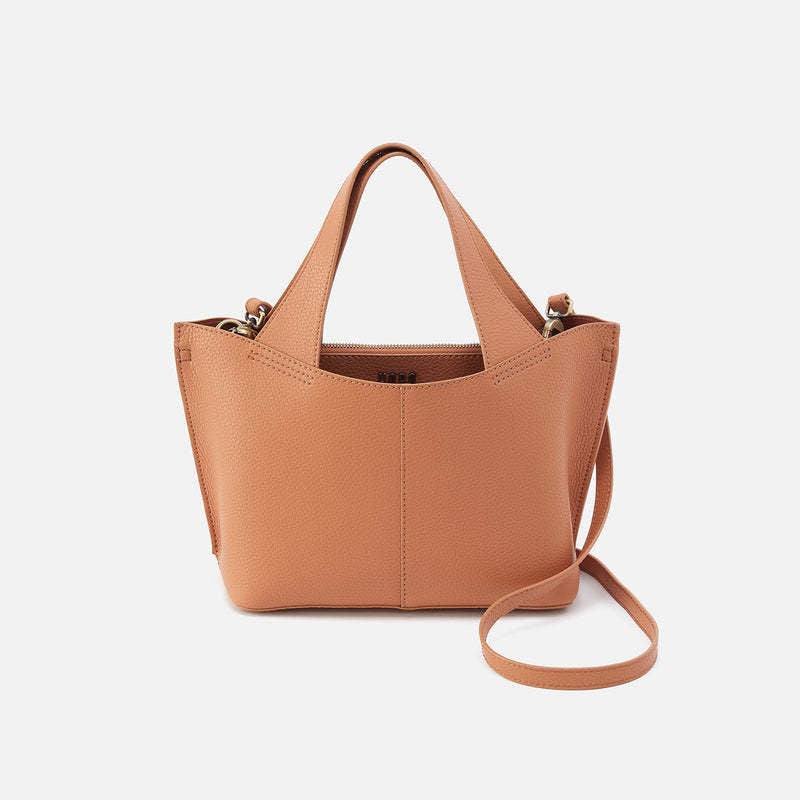 Small tote bag in biscuit leather with antique brass hardware.