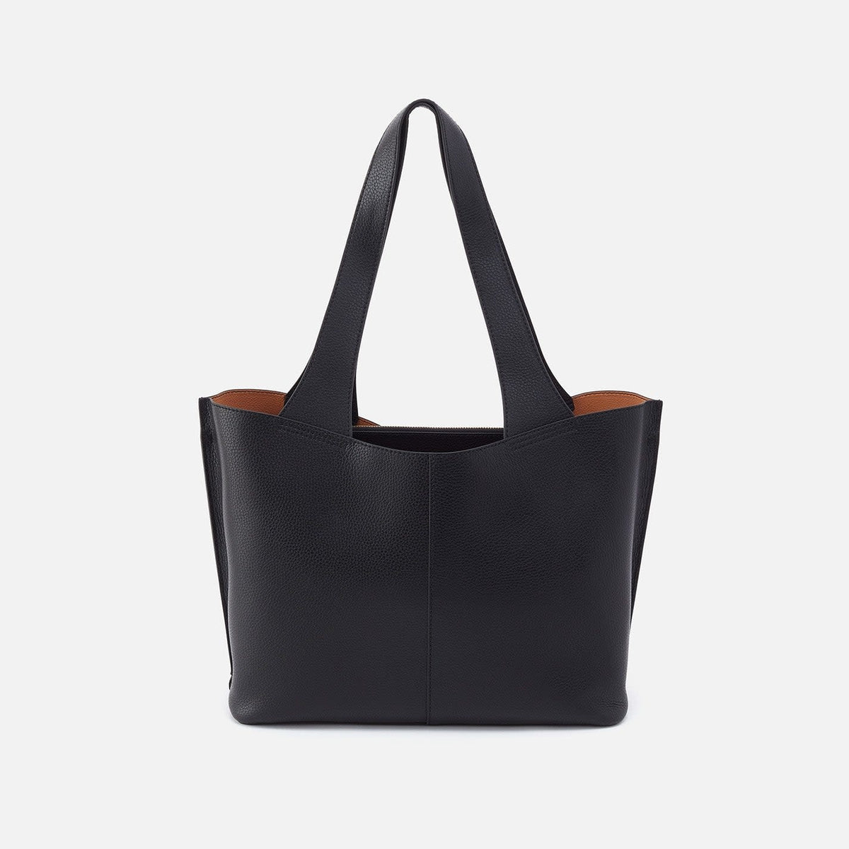 Black leather Vida tote with coconut shell interior lining, brass hardware, slip pockets, and double straps.
