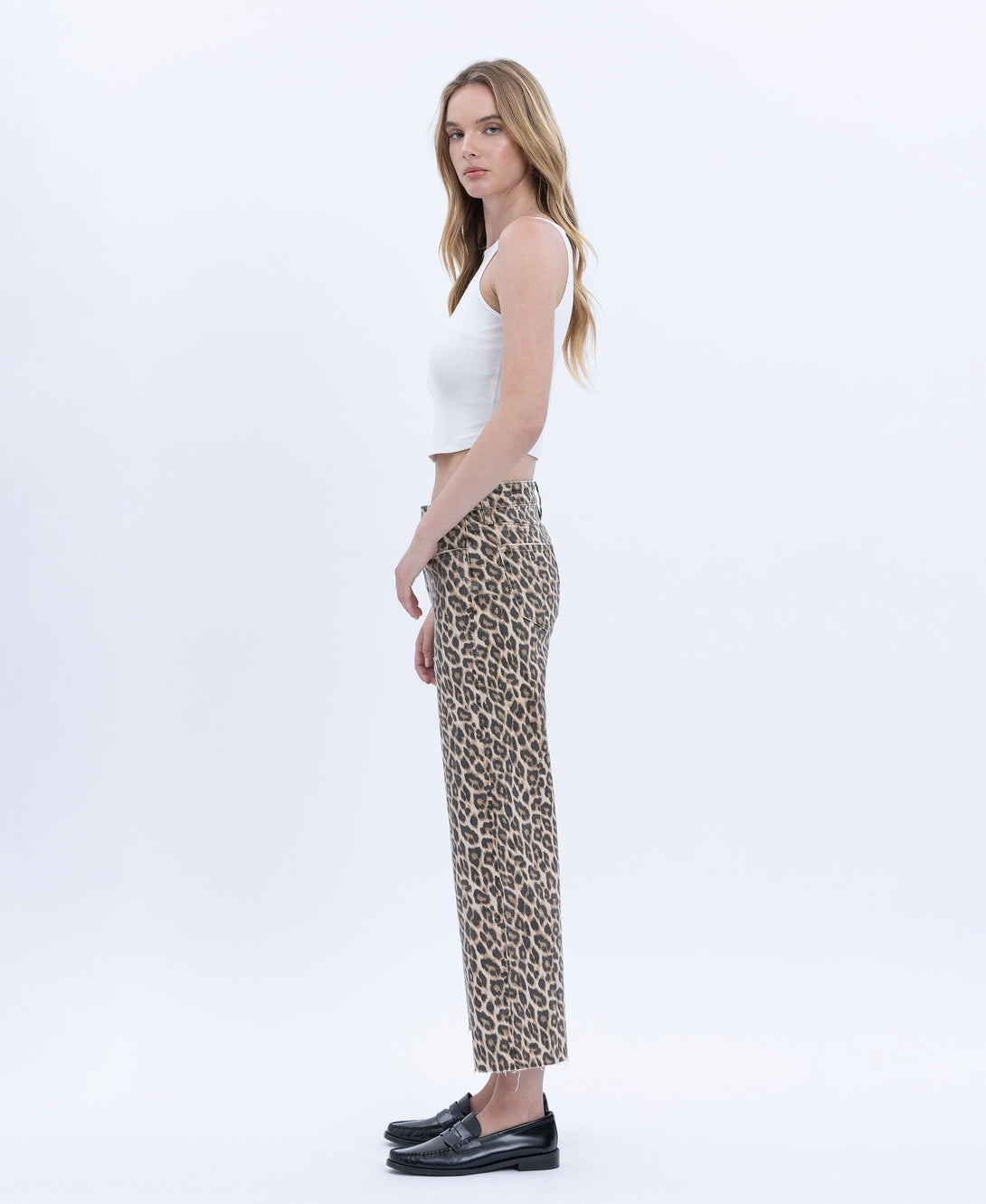 Women's high-rise animal print wide-leg crop jeans with raw hem in stretch denim.