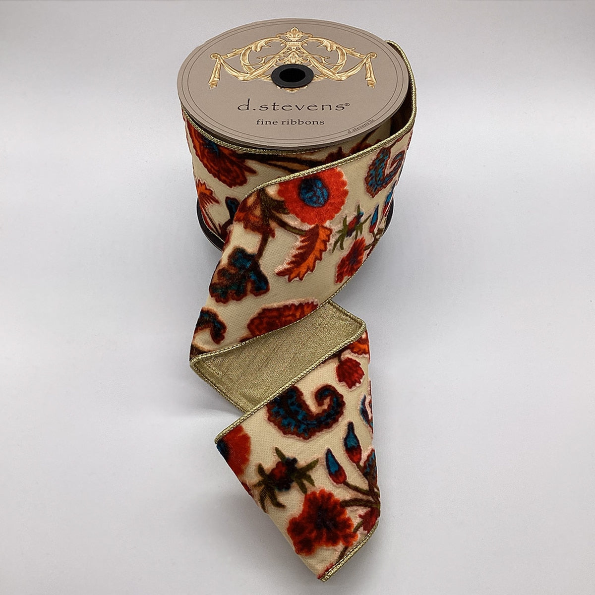 Burnt Out velvet fabric swatch featuring a Highgrove floral pattern in cream blue and orange.