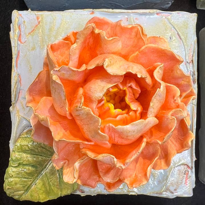 4x4 inch square clay artwork featuring a rose relief with textured petals in earthy tones.