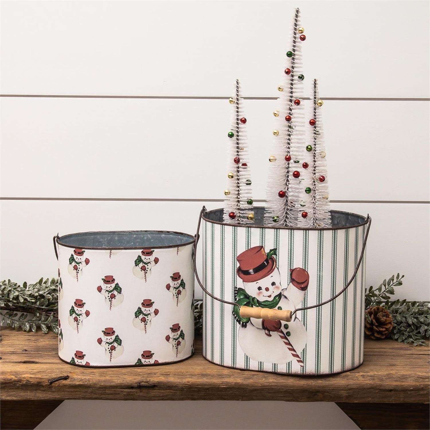 Metal vintage snowman container with classic festive design holding holiday treats
