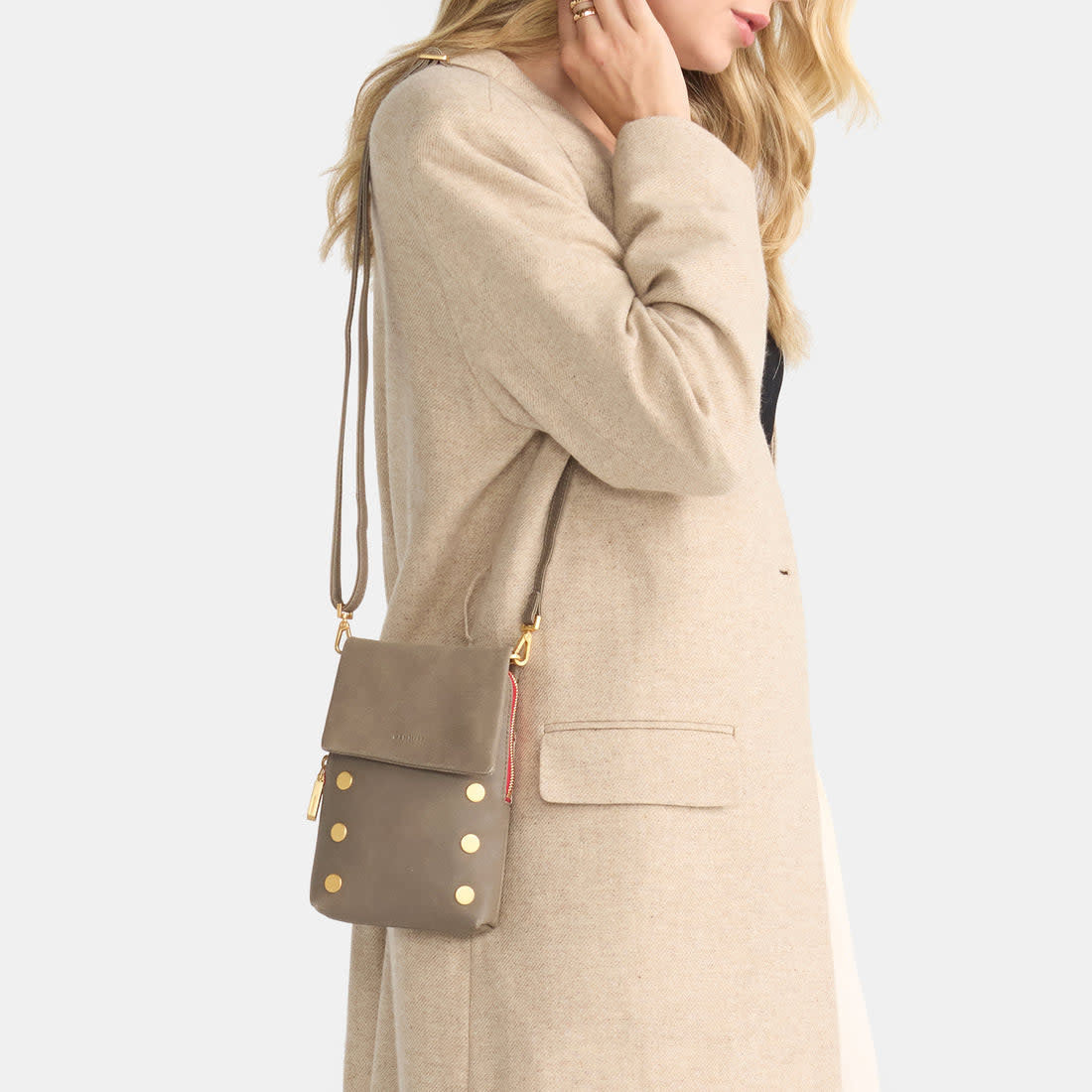 Pewter brushed gold crossbody bag with red zipper detail