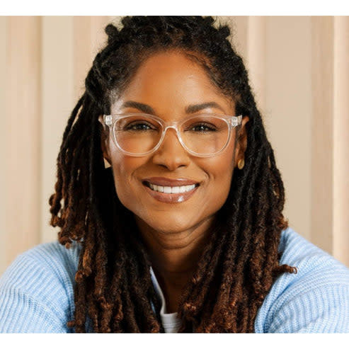 Virginia eyeglasses with clear acetate frames featuring angular faceted temples and a soft square silhouette.