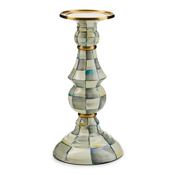 Mackenzie Childs hand-painted check pillar candlestick with brass accents and a bronzed rim.