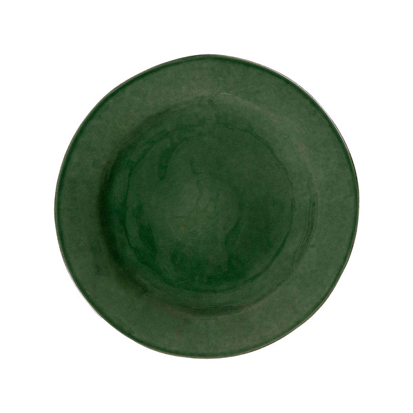 Top view of a round, dark green ceramic Puro dessert and salad plate with a textured glaze.