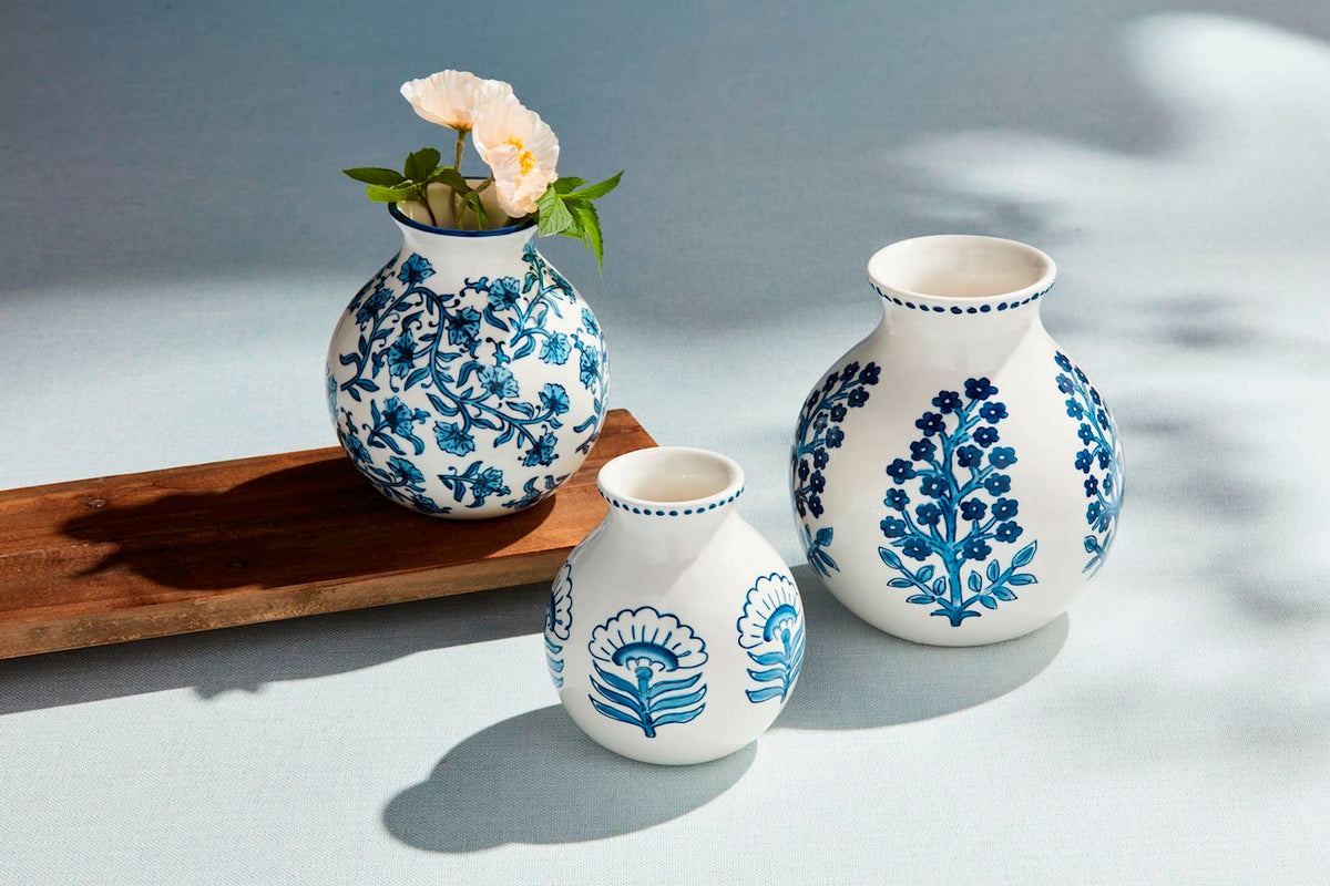 Block print flower vase with hand-painted interior floral pattern in stoneware.