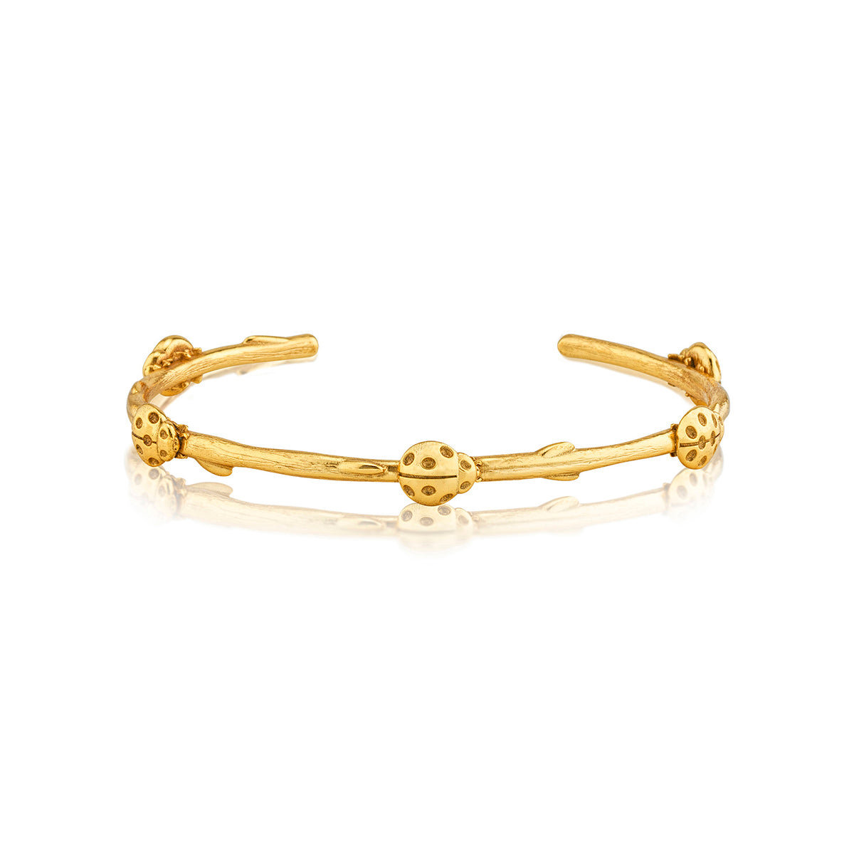 Gold-plated brass petite cuff bracelet featuring a meadow ladybug pattern.