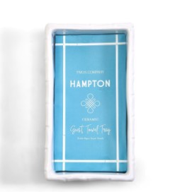 White ceramic faux bamboo guest towel tray with a blue Hampton insert inside.