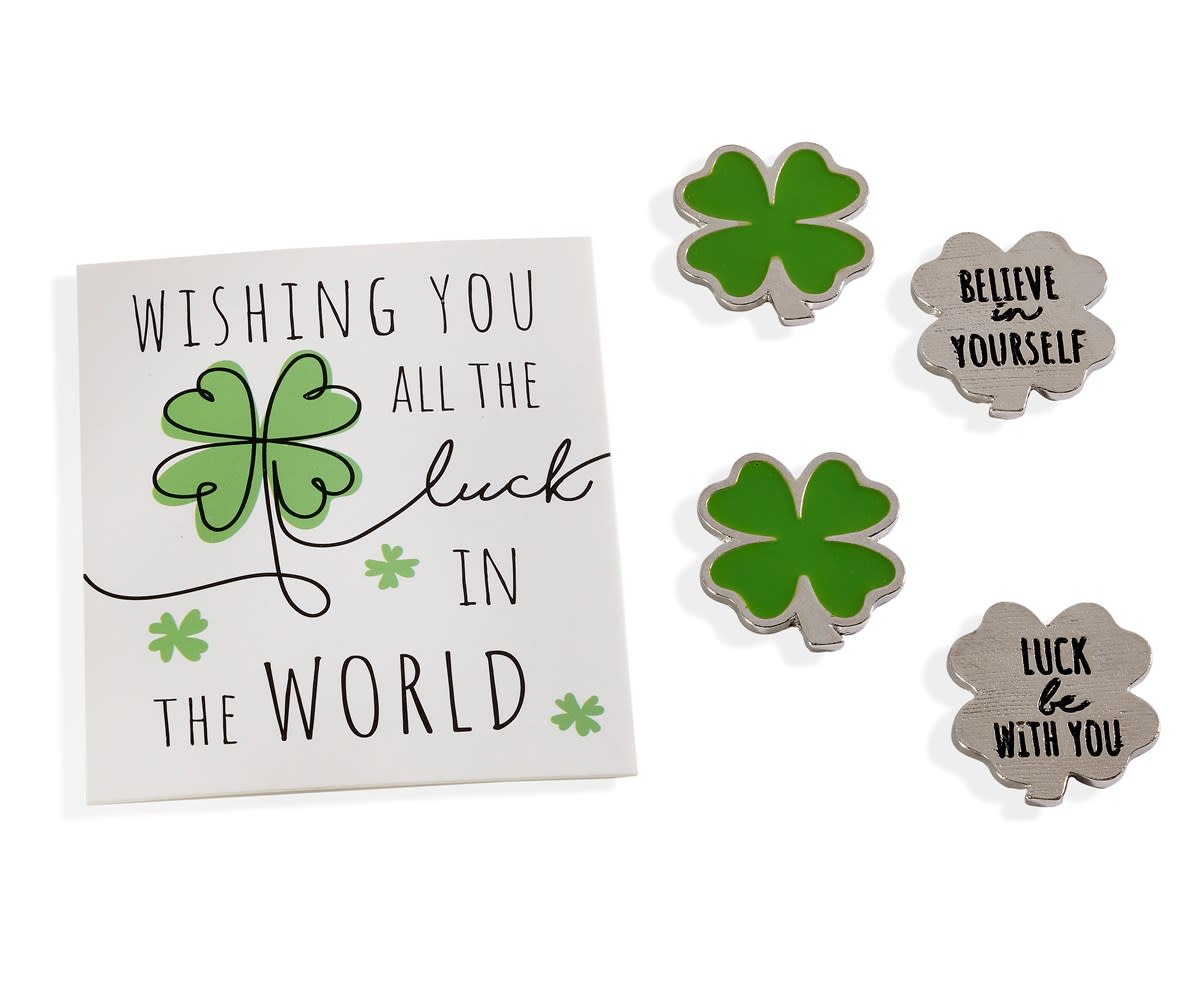 Lucky clover tokens and a sign that says "Wishing you all the luck in the world."