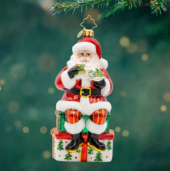Kris Kringle's Cookie Break ornament shaped like a gingerbread man with red hat and white trim.