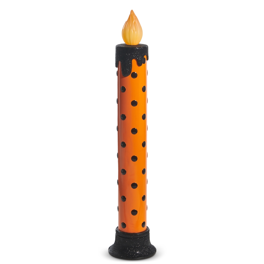 38-inch orange Halloween candle with black polka dots, glittery black base, and faux flame.