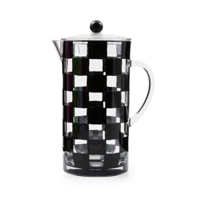 Clear acrylic pitcher with a black and white checkered pattern, featuring a lid and handle.