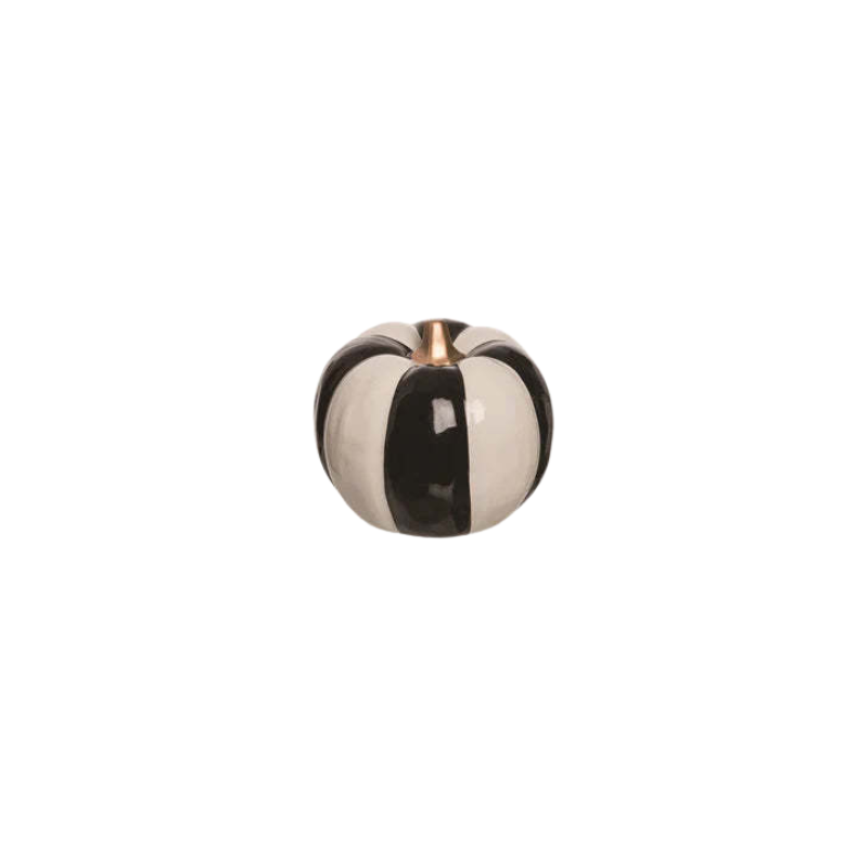 Small ceramic pumpkin with vertical black and white stripes and a gold stem.