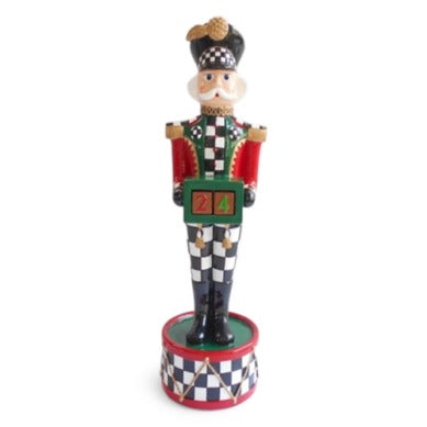 Countdown Musical Nutcracker figurine with a checkered pattern holding a numbered countdown block.