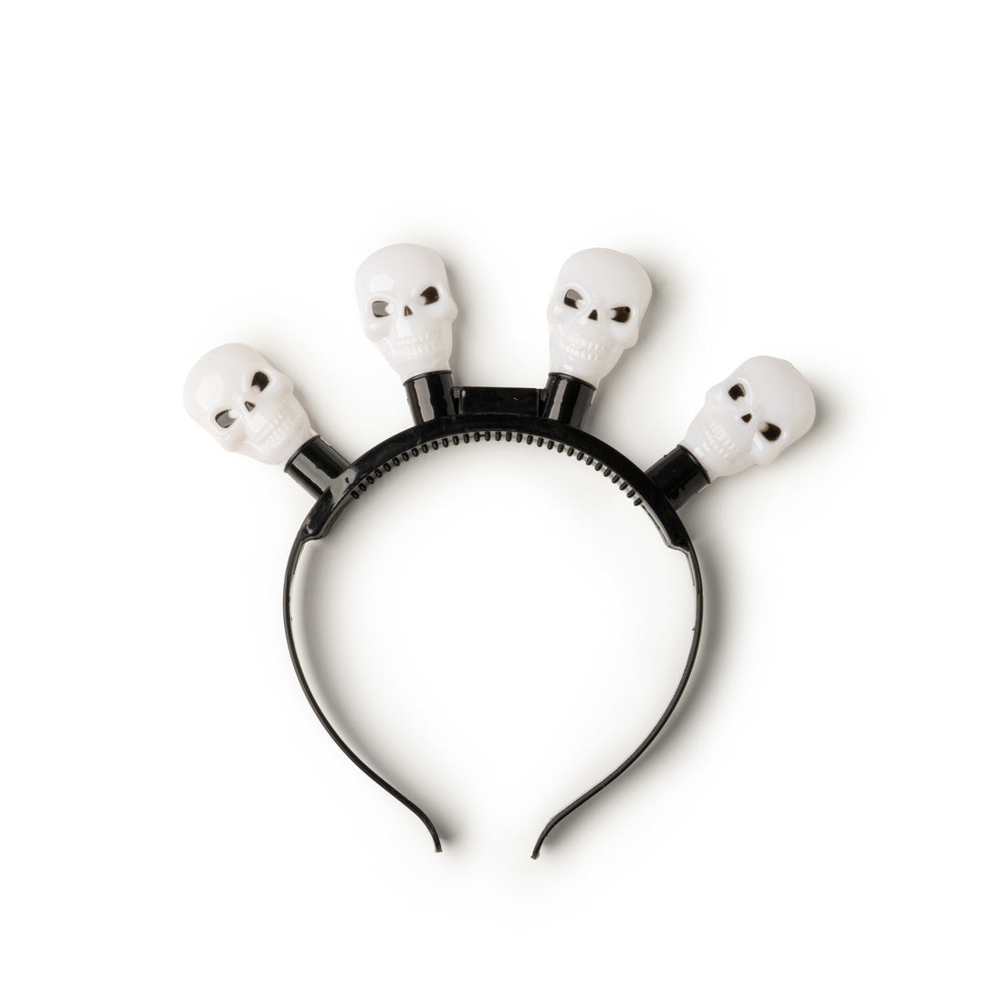 Black headband with four white skull-shaped LED lights for Halloween.