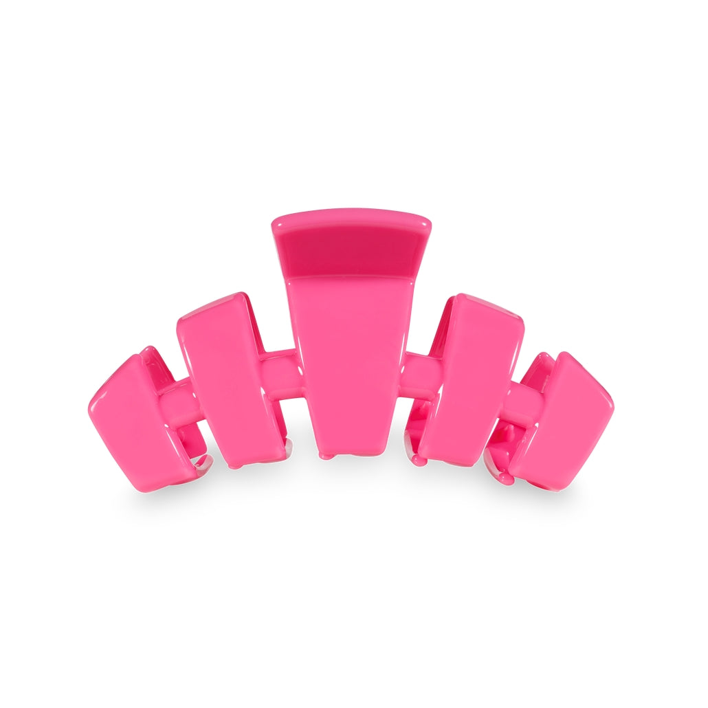 Medium-sized classic hair clip in a neutral tone with an open comb design.