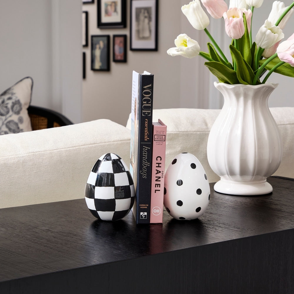 Hand-painted resin Easter egg with festive colors on a white background.