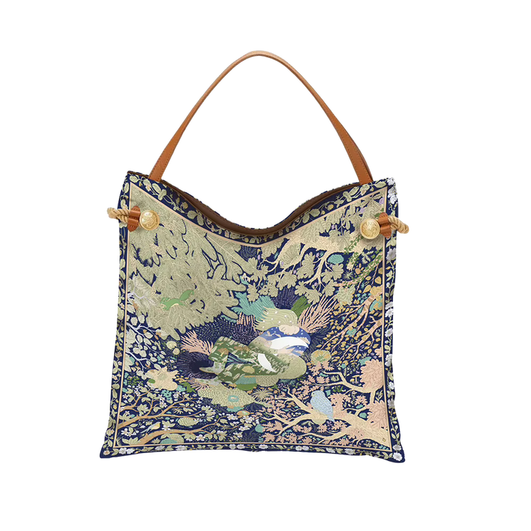 Boho Scarf Tote Bag with intricate blue and green nature pattern and tan leather shoulder strap.