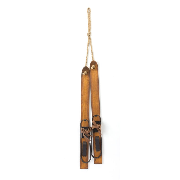 Large wooden ski ornament with rope hanger and vintage-style bindings.