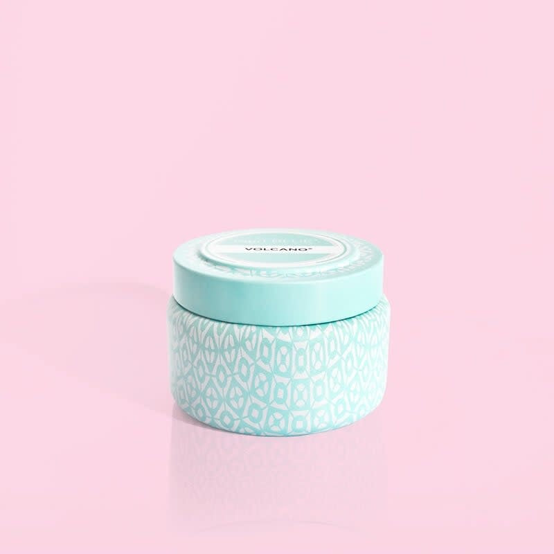 Volcano Aqua printed travel candle in a white tin with aqua tropical fruit pattern and citrus notes.