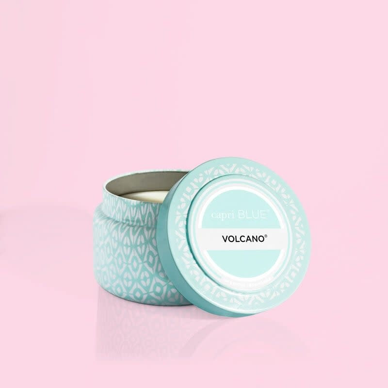 Volcano Aqua printed travel tin candle with white tropical fruit notes in aqua and white packaging