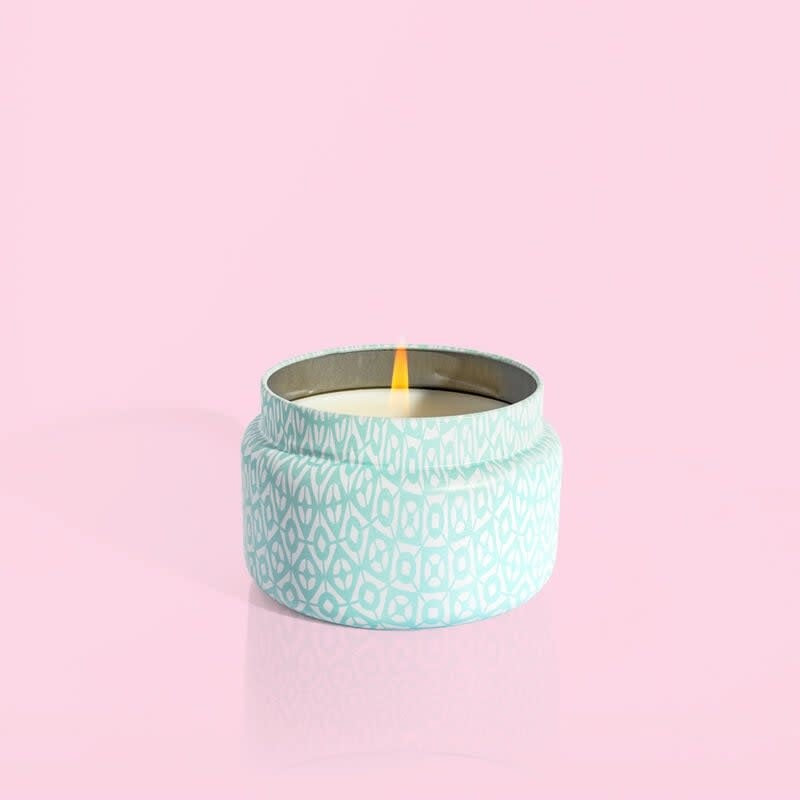 Volcano Aqua printed travel tin candle with white tropical fruit notes in aqua color