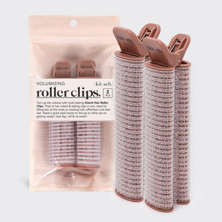 Set of black volumizing roller clips with velcro rollers and styling grips.
