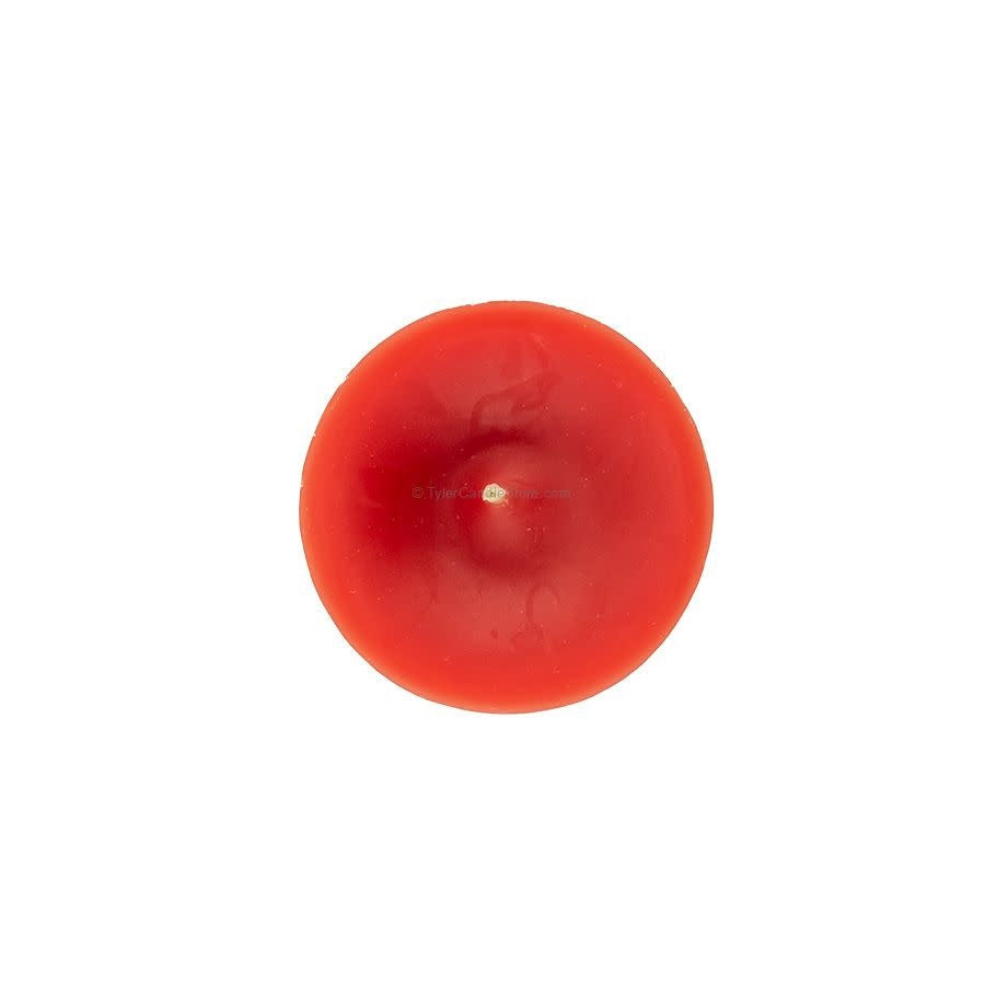 A round, red votive candle viewed from directly above, showing a centered wick.
