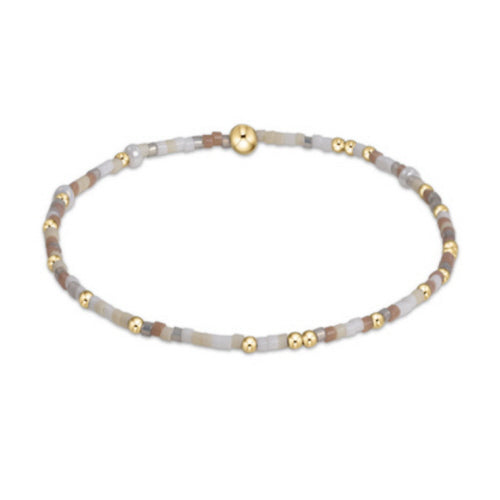 Egirl Hope Unwritten bracelet featuring gold-filled beads with multicolored seed bead accents on stretch elastic.
