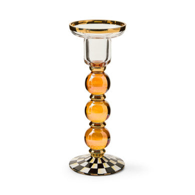 Hand-painted glass candlestick with gold luster accents, standing tall.