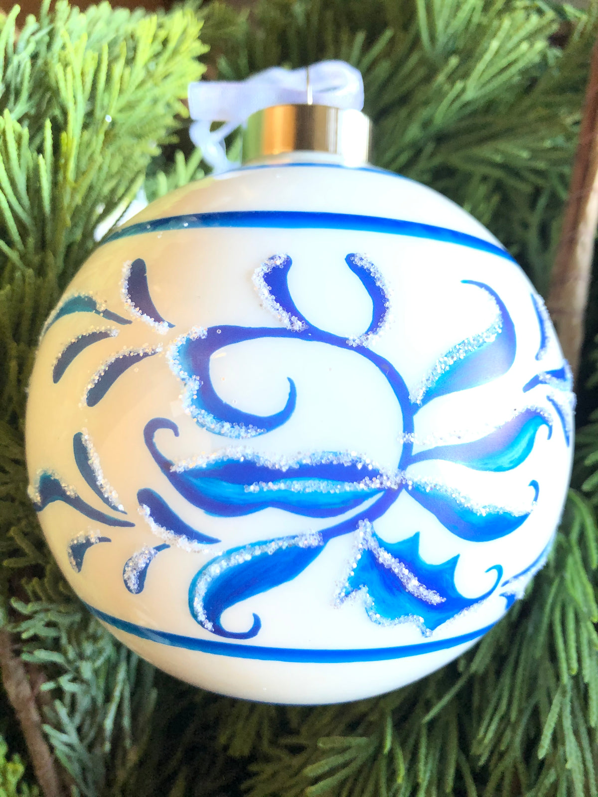 Blue scroll-patterned ball with white accents
