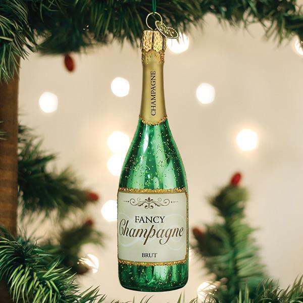 Green glass Fancy Champagne Bottle ornament with gold glitter accents hanging on a Christmas tree.