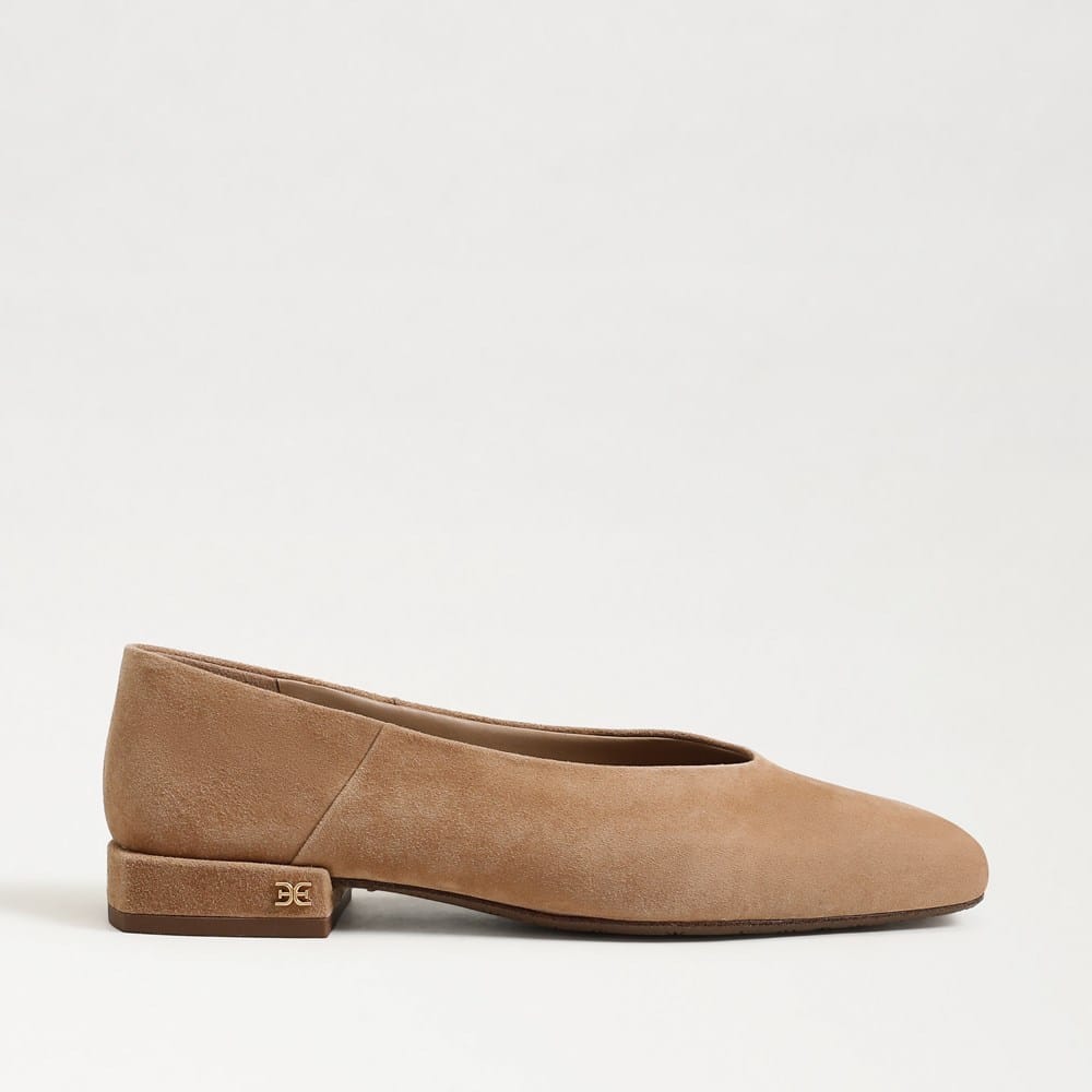 Tan suede Kasey square toe ballet flat with a low block heel and small metallic logo detail.