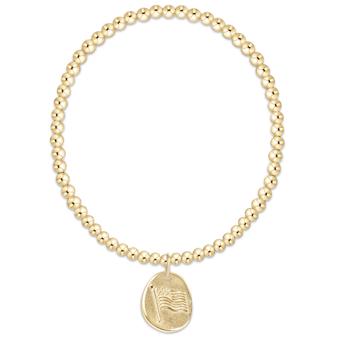 Classic gold 3mm beaded bracelet with a round gold charm featuring an American flag design.