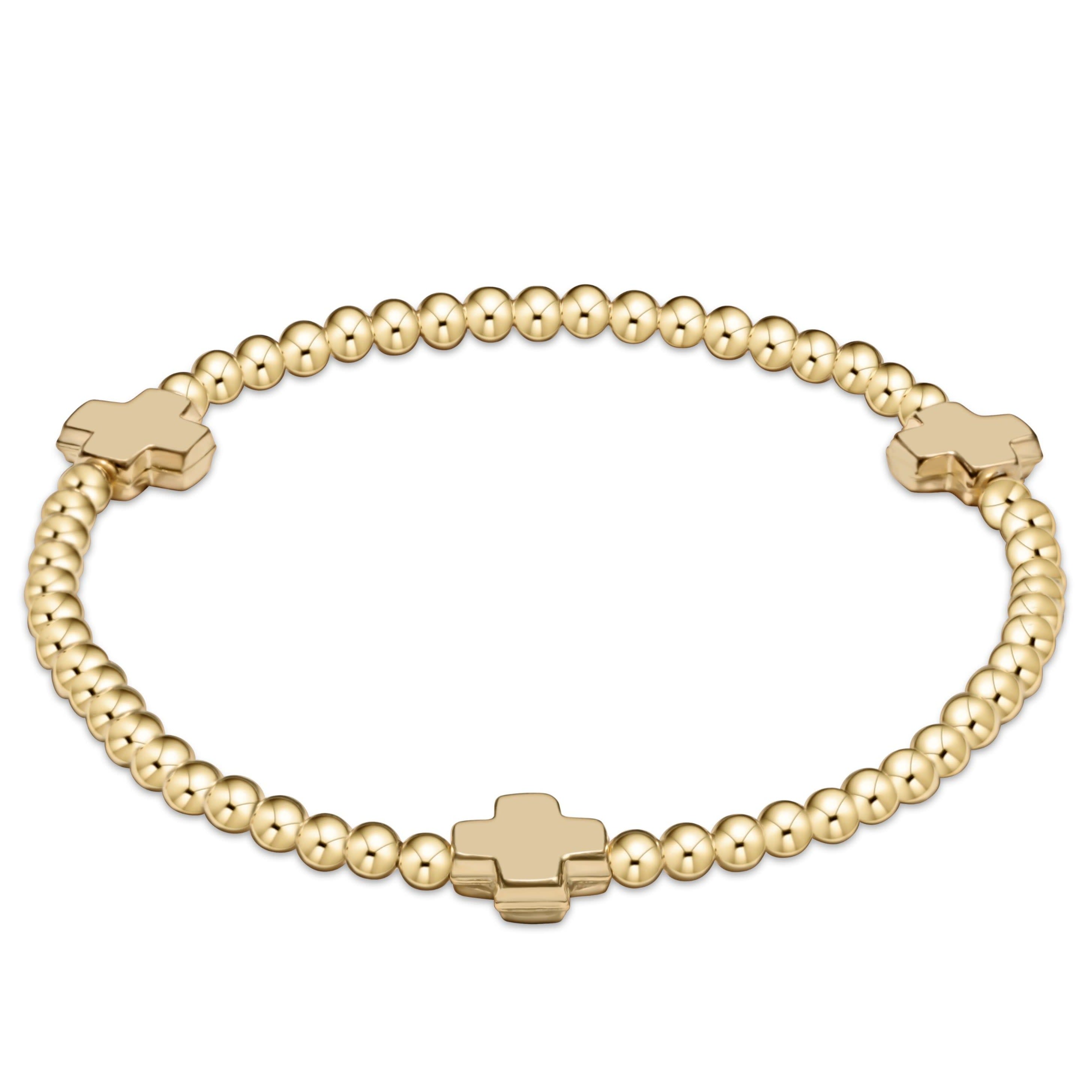 3MM gold-filled bead bracelet featuring a signature cross pendant on stretch elastic.