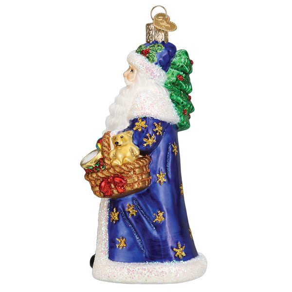 Regal Father Christmas glass ornament in a blue robe holding a basket with a teddy bear.