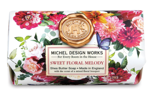 Michel Design Works Sweet Floral Melody shea butter soap bar with a colorful floral pattern.